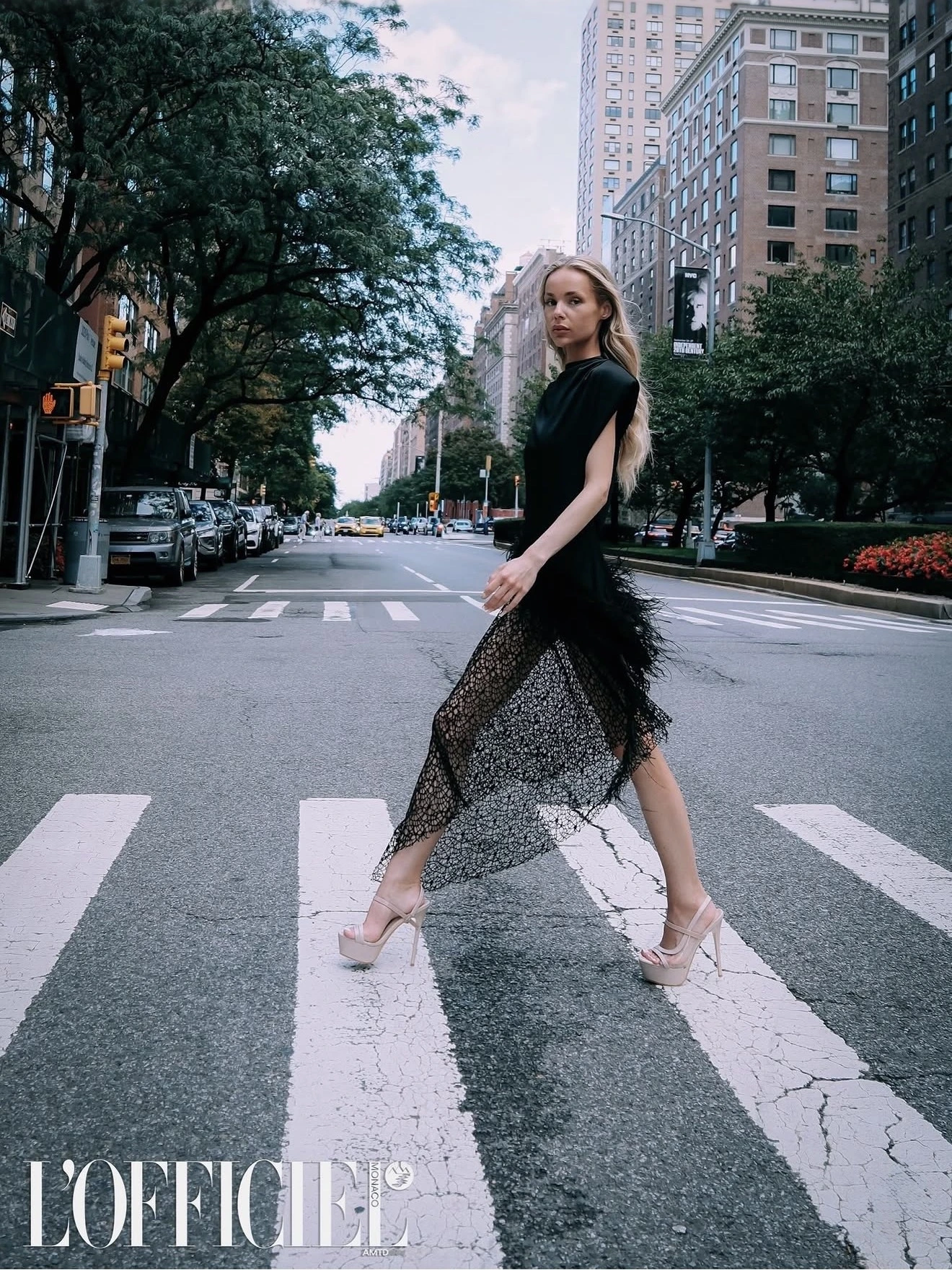 L’Officiel Monaco editorial: flowing blonde hair and a black dress on a New York street