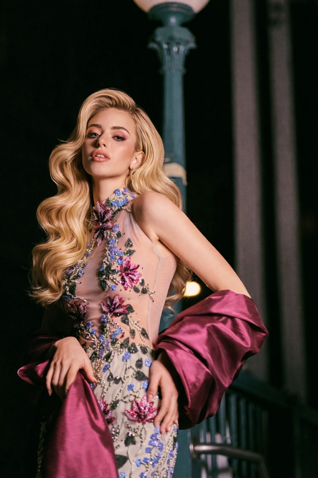 Valeria Di Martino, Miss International Venezuela 2026, wearing a floral gown with Hollywood waves styled by Mirna Franco